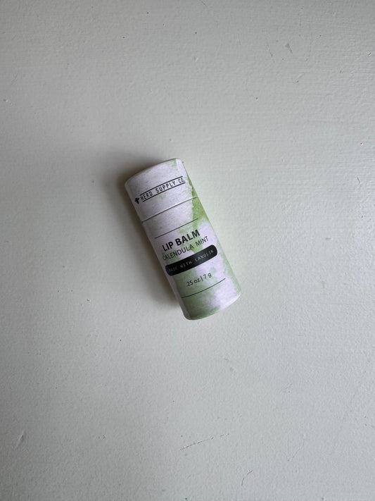 Lip balm on a light gray surface